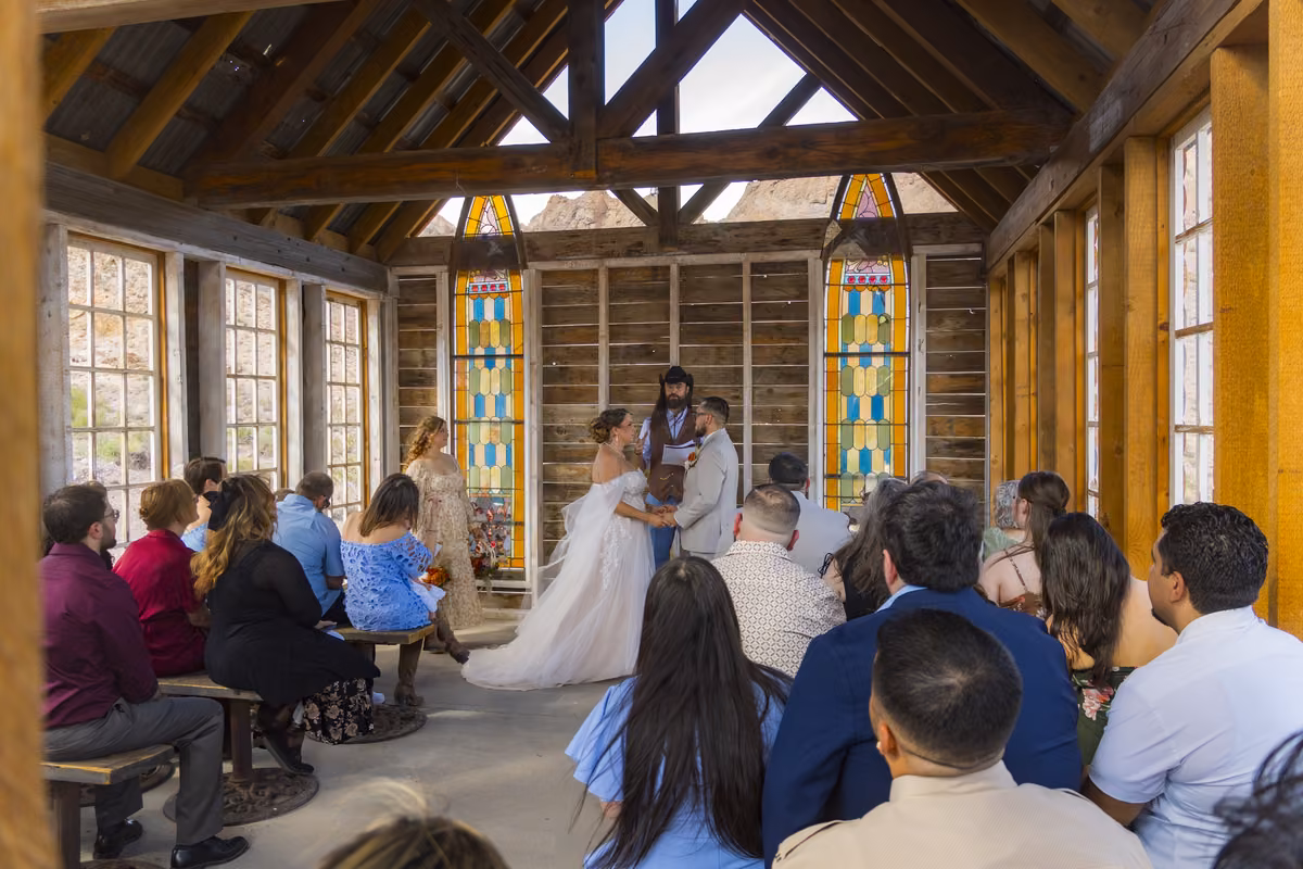 Wedding ceremony inside the stained-glass chapel at Nelson Ghost Town